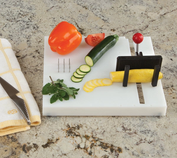 Modified chopping board with adaptive features including spokes and a clamp