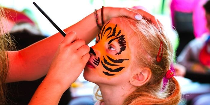 face painting a child