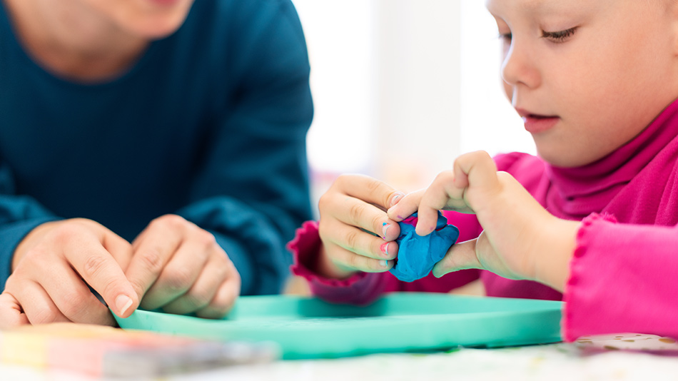 Therapist and a child during an OT session