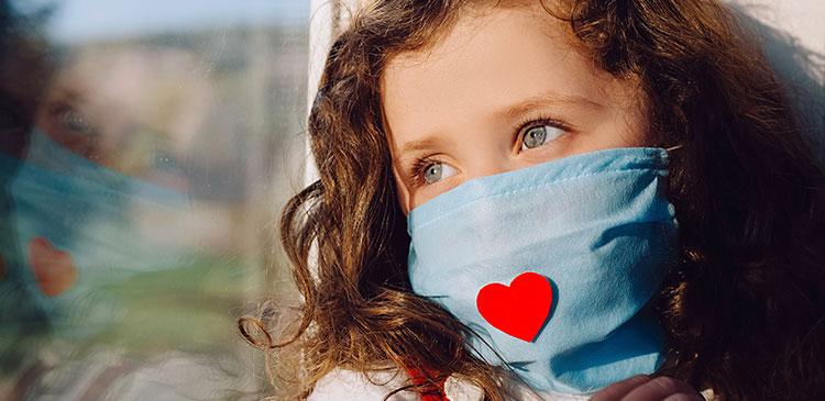 young girl wearing a mask