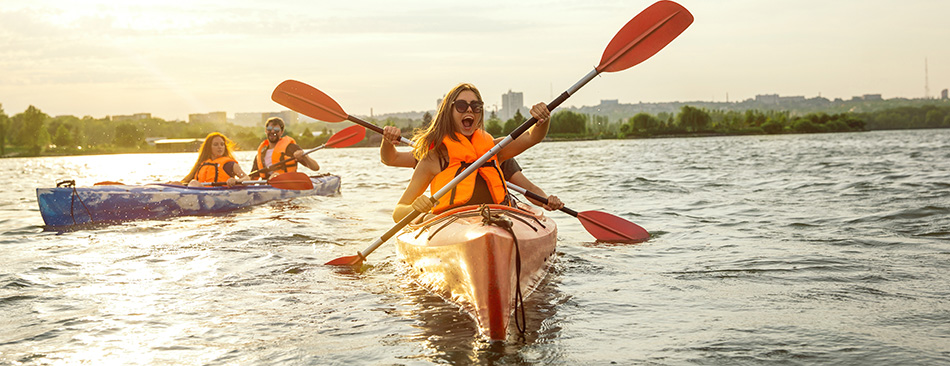 People having fun together canoeing