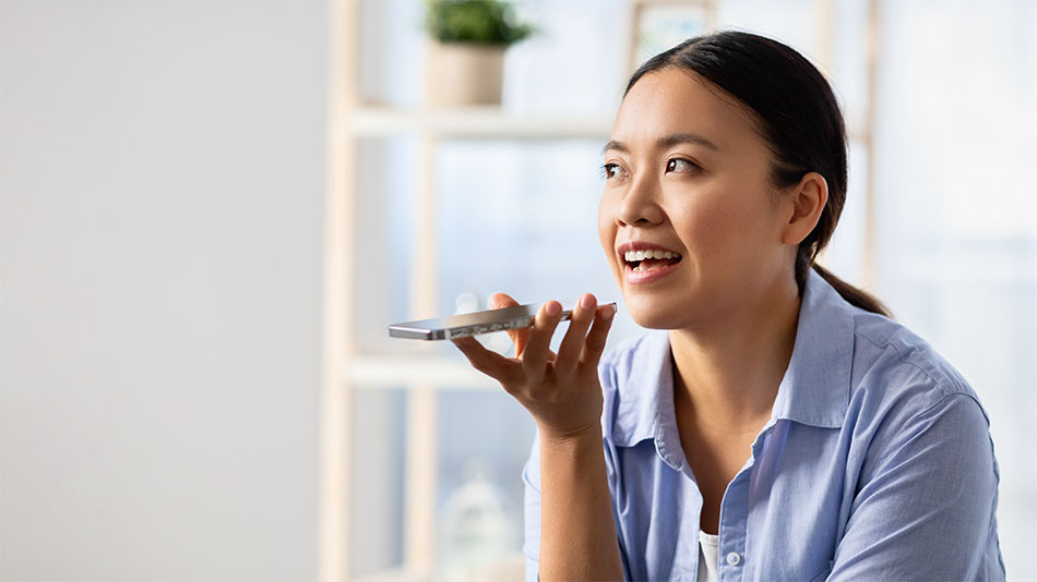 A woman recording case notes on her phone