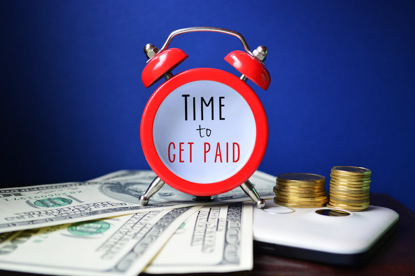 Alarm clock with a face that says Time to Get Paid
