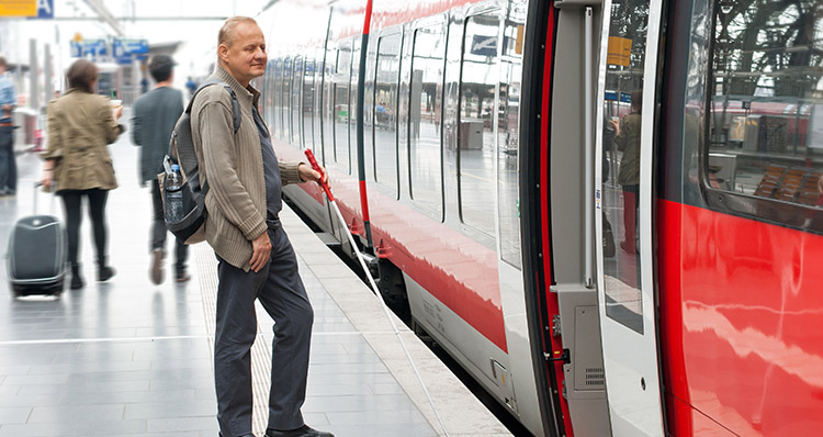 Blind man waiting for a train