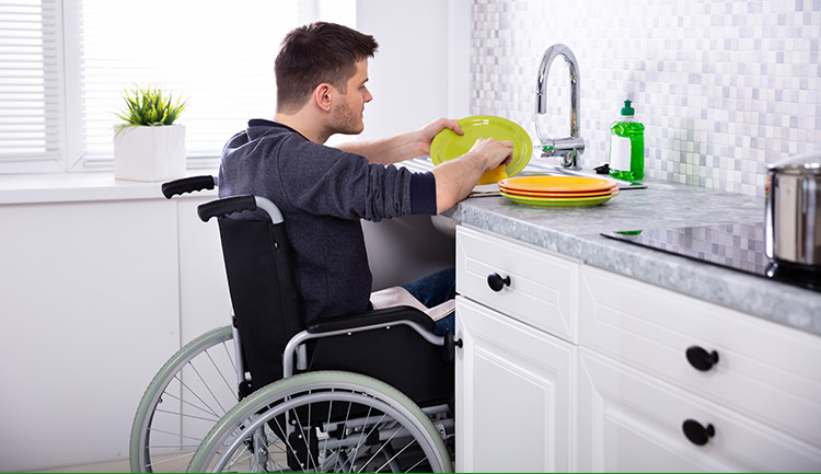 Young man at a sink