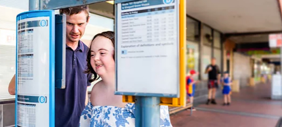 Support worker with a participant learning to catch the bus