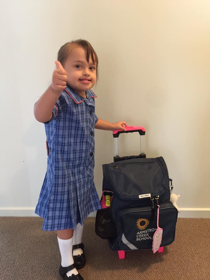mAia holding her suitcase