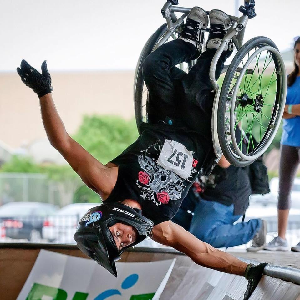 Aaron fotheringham in midback on his wheelchair at a skate ramp