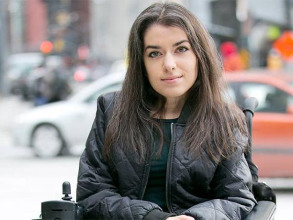 Maayan Ziv poses in front of an urban backdrop
